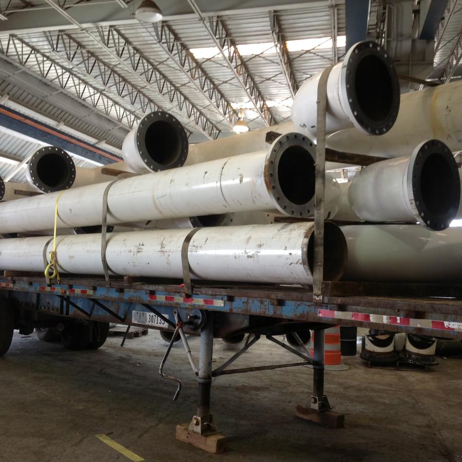 Piping components stacked in warehouse